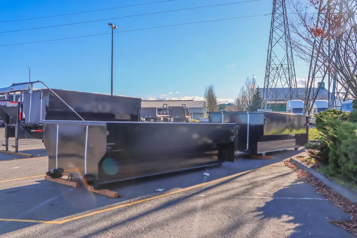 Roll-off dumpster ready for waste disposal at job site for 2 Yard Dumpster Rental in Orosi